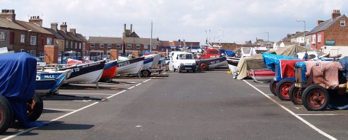 In a street behind the high street the fishing cobble boats and tractors are parked!
