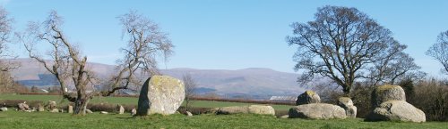 In the distance beyond these huge stones rises Cross Fell
