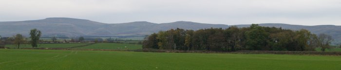 Distant profile of Cross Fell and other Pennine Hills - River Eden walk, Bolton Village near Appleby, Cumbria, Northern England