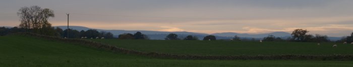 The distant Cumbrian Hills of the Lake District. - River Eden walk, Bolton Village near Appleby, Cumbria, Northern England