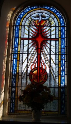 A relatively modern peace of stained glass in one of the south wall windows - Penrith Town, Cumbria, Northern England
