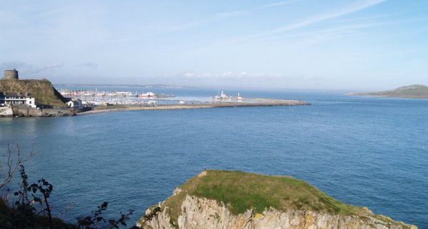 Heading out to the Cliffs of Howth and looking back towards the Martello Tower,  the harbour breakwater and Irelands Eye island.