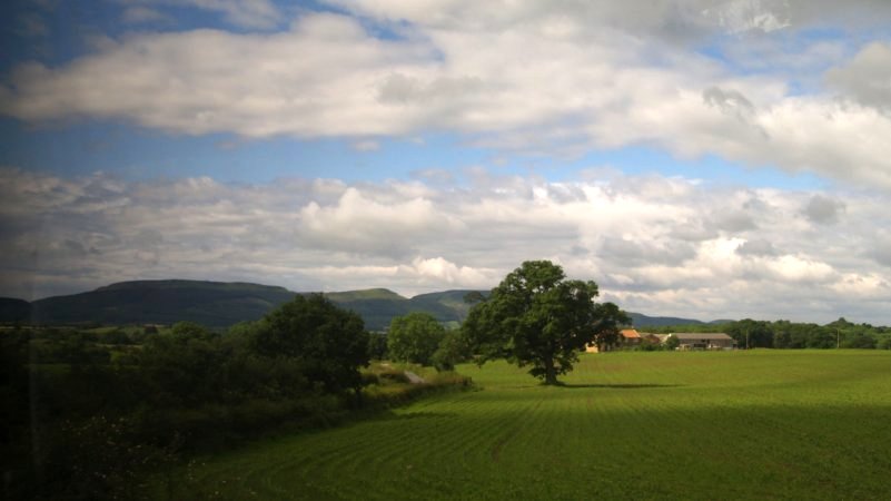 Location 04c: On the opposite side of the track from Roseberry Topping, through the carriage window, you get the first glimpse of the 'Cleveland Hills' through the train window.