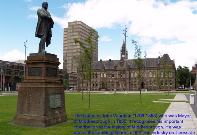 Location 00b: In Middlesbrough, across from the Town Hall in the square is a statue of John Vaughan (1799-1868) who was Mayor of Middlesbrough in 1855. It recognises his important contribution to the history of Middlesbrough. He discovered ironstone in the Cleveland Hills and was one of the founding fathers of the iron industry on Teesside. He was in a partnership that built one of the first iron works in Middlesbrough in 1840. On the base of the statue are four cast bronze plaques describing aspects of Middlesbrough's industrial heritage.