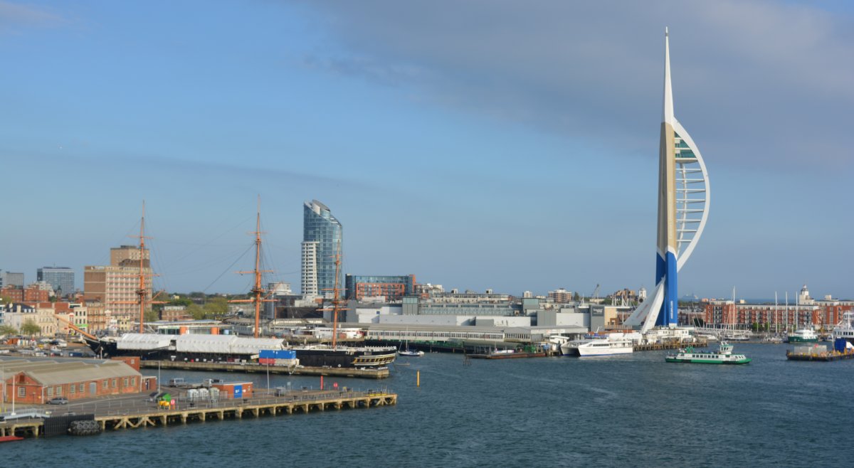 historic Portsmouth Dockyard is the Royal Navy ship HMS Warrior, on the right the Spinnaker Tower sculpture Portsmouth to Santander Brittany Ferries