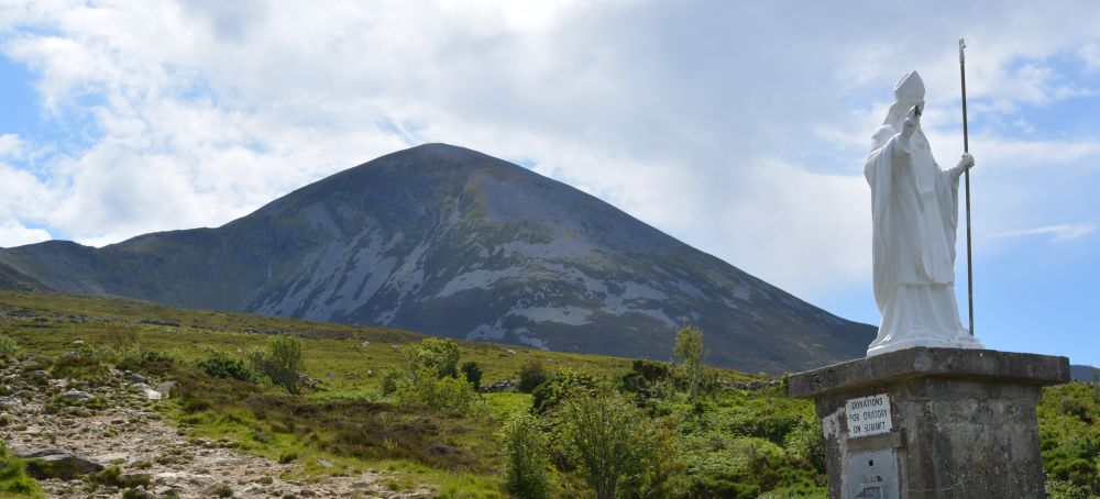 The white statue of St Patrick at the start of the footpath to climb up Croagh Patrick Climbing Croagh Patrick Co. Mayo