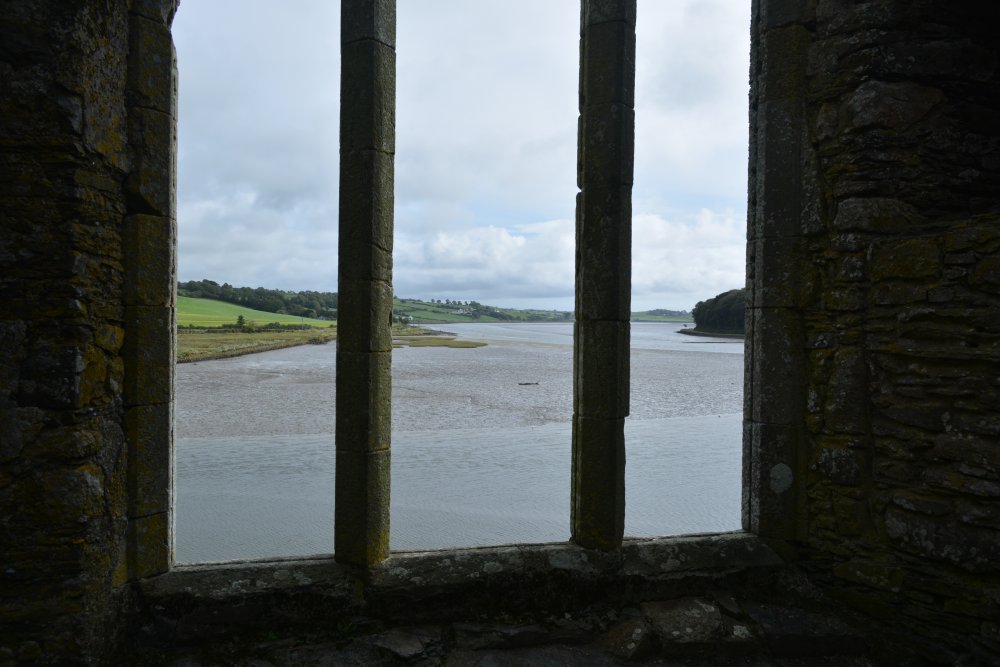 Looking out from the great east window of Timoleague Friary to Coutmacsherry Bay Co. Cork, West of Ireland
