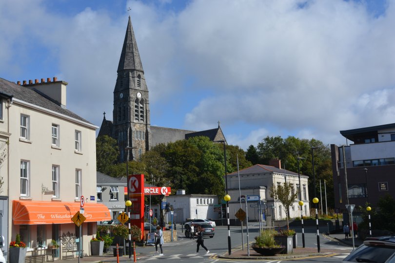 Main Street Clifden, on the right the Whitethorn Gallery and towering over it, the spire of St Joseph's Church Clifden Town, Connemara, Co. Galway, Ireland