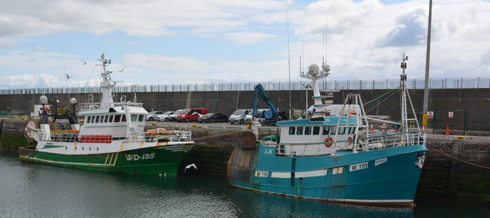 Fishing vessels WD.135 KENNEDY and W.110 EXCEL moored up in Dunmore East harbour summer 2025