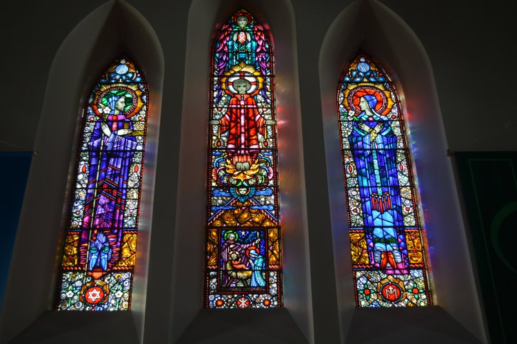The Harry Clarke stained glass windows above the altar of St Mary's Catholic Church, Castlegregory, Dingle Peninula, Co. Kerry, Ireland