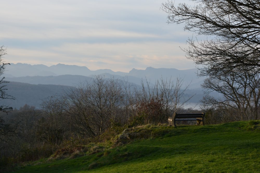 A view from above Windermere Town over Lake Windermere to the Langdale Pikes