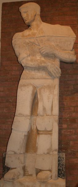Museum of Liverpool: 'The Builder' and 'The Architect' from Gerard Gardens. Liverpool Sculptor George Herbert Tyson Smith made these relief sculptures for the Gerard Gardens flats. They represent an architect and a builder carrying a hod of bricks and were saved from destruction when the flats were demolished in 1987.