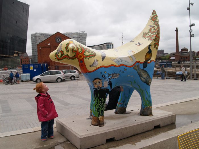 Museum of Liverpool:  lambnana sculpture outside the entrance with a very young admirer