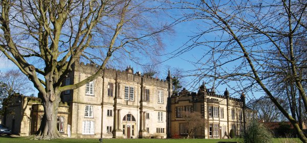 The magnificent architecture of the Old Lodge Hotel set in attractive gardens.