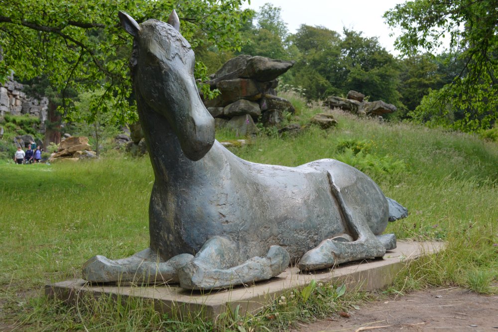 The fine reclining horse sculpture in the grounds of Chatsworth House Derbyshire Dales