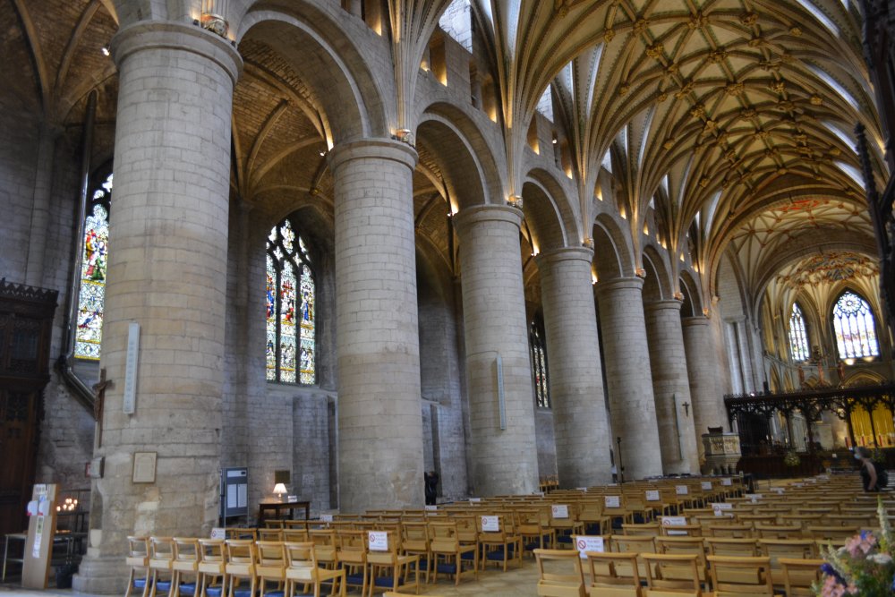 The mighty columns and north aisle of the nave of Tewkesbury Abbey Gloucestershire England