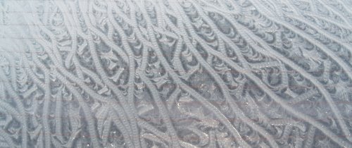 Ice rivulets on car windscreen