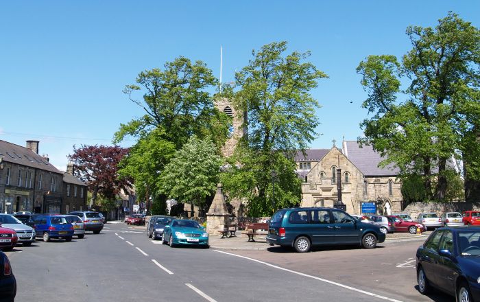 The centre of Corbridge, Market Square, St Andrew's Parish Church and the market cross.
