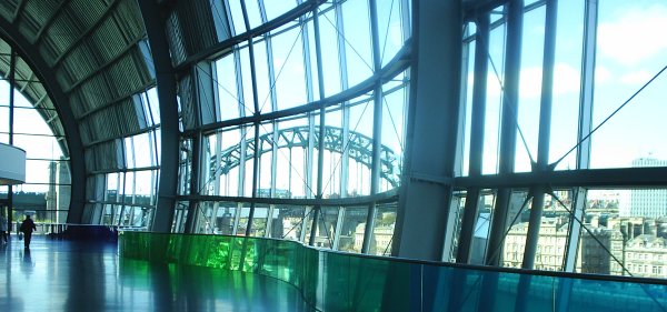 The green coloured glass of the Sage with the Tyne Bridge in the background