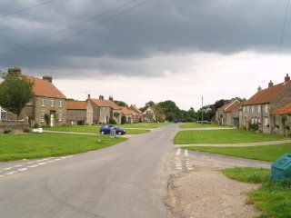 Levisham is another quiet village in North Yorkshire with a broad green-lined road in the centre, North York Moors, England