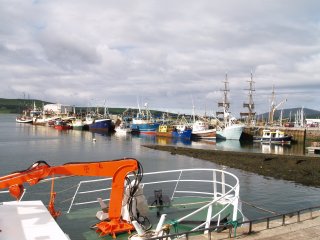 Dingle, Dingle Peninsula, Co. Kerry, Ireland, is bustling tourist town and a busy and attractive harbour setting with many colourful houses and interesting shops and innumerable places to eat.