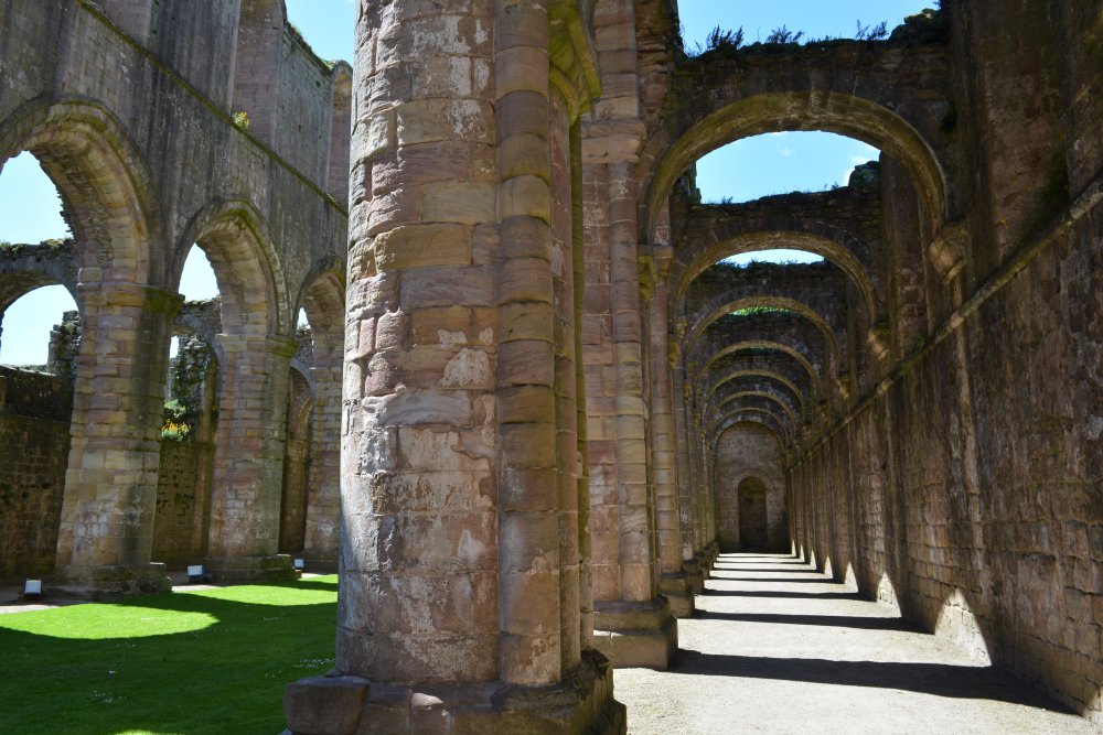 Looking west down the north aisle of the nave of Fountains Abbey