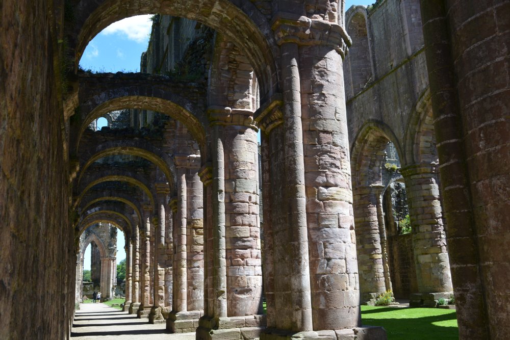 Looking east down the north aisle of the nave of Fountains Abbey