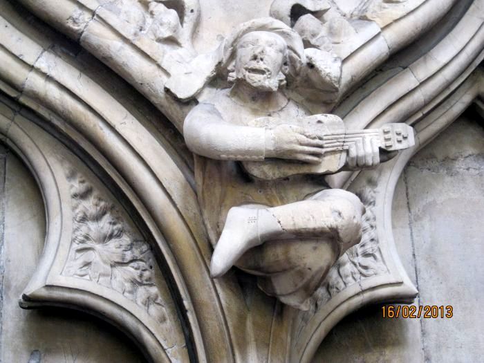 stone carvings north wall of north aisle of the nave of Beverley Minster quite detailed sculptures of musicians and their instruments