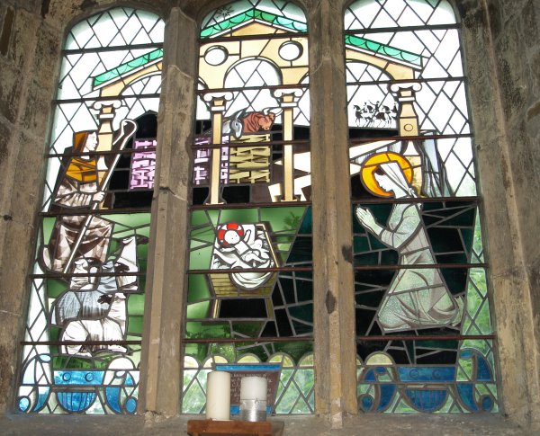 Some of the modern stained glass windows but still contained in the medieval tracery of the stonework of the medieval windows St Helen's Church Stillingfleet