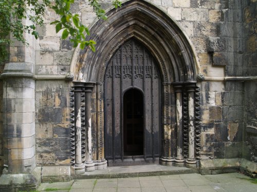 The fine arched carved stone entrance to Holy Trinity Church, Micklegate (original medieval or rebuilt work?).