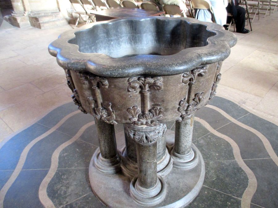 Peterborough Cathedral: The medieval font is a carved 13th century marble bowl supported by five pillars.