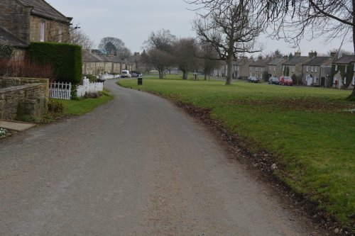 The broad green and two rows of houses of the village of East Witton