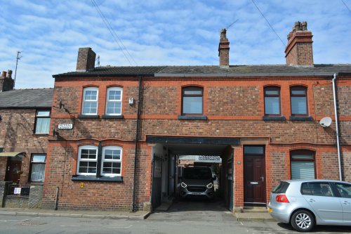 entrance to the yard next to the house in Sewell Street Prescot, Merseyside, my mother was born into.