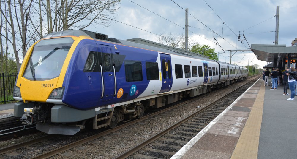 A CAF built 3-car diesel multiple unit Class 195 195118 at Newton-le-Willows station with a Northern Rail service from Manchester to Chester (April 2023)
