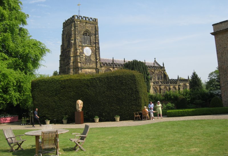 The great medieval building of St Mary's Parish Church overlooks the entrance to the Thirsk Hall sculpture garden