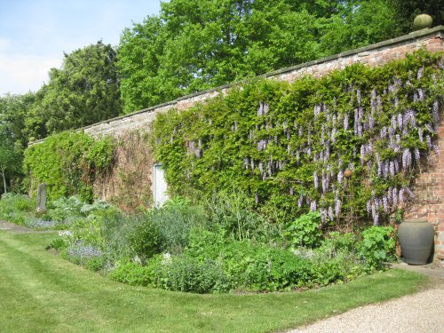A few ceramic sculptures in the walled garden. Thirsk Hall Sculpture Garden, North Yorkshire, England
