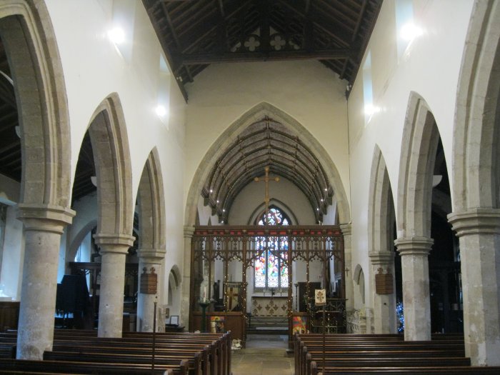 view down the nave to the chancel and altar of the internal architecture of All Saints Church, Ripley, North Yorkshire, England