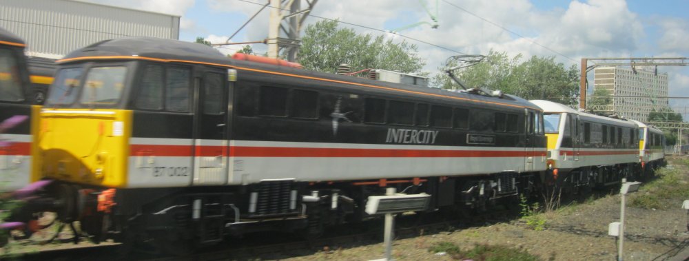 Class 87 electric locomotive 87002 Royal Sovereign Locomotive Services Limited, InterCity Swallow Livery (Crewe May 2024)